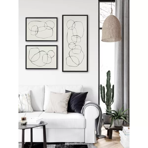 Kate and Laurel Sylvie Dancing Circles Framed Linen Textured Canvas Wall Art by Teju Reval of SnazzyHues 18x40 Gold Neutral Abstract Wall DecorBlack