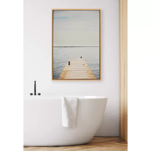 Kate and Laurel Sylvie Standing On Dock Framed Canvas Wall Art by Laura Evans 23x33 Natural Beautiful Coastal Wall Decor