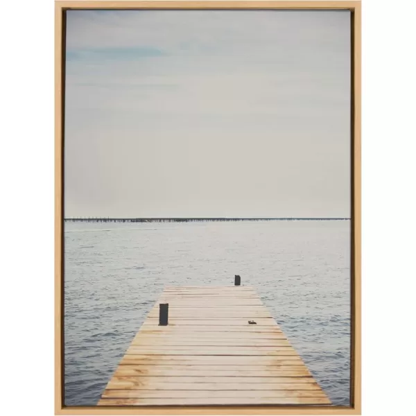 Kate and Laurel Sylvie Standing On Dock Framed Canvas Wall Art by Laura Evans 23x33 Natural Beautiful Coastal Wall Decor
