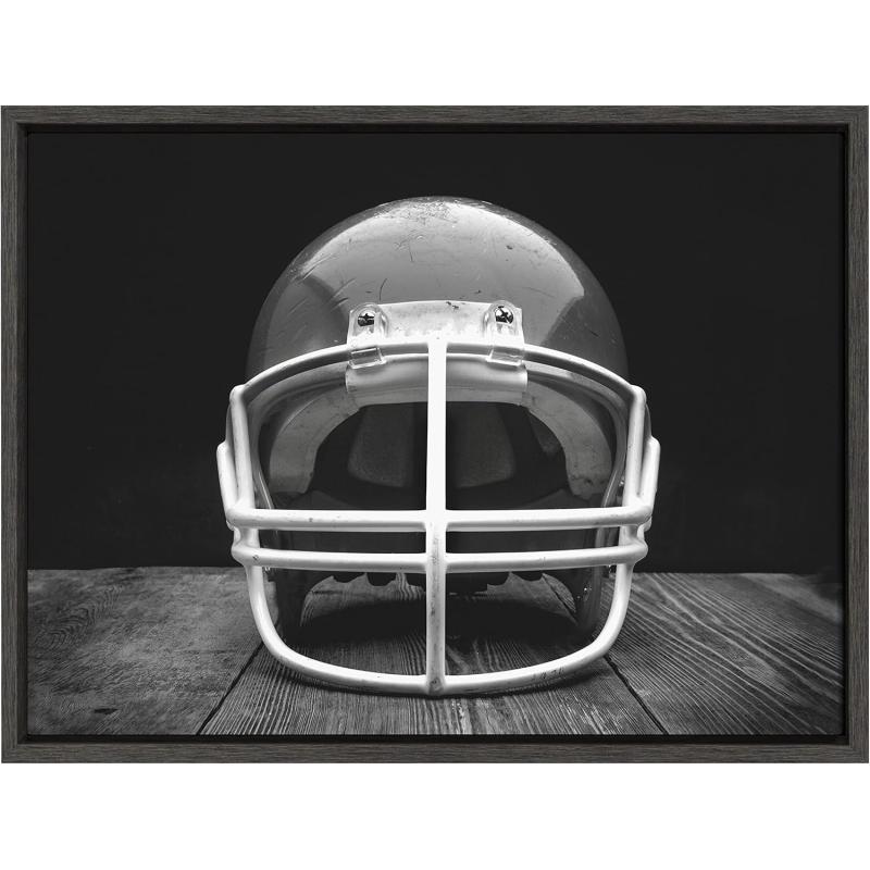 DesignOvation Sylvie Vintage Football Helmet Framed Canvas Wall Art by Shawn St Peter 18x24 Gray SportsThemed Home Decor