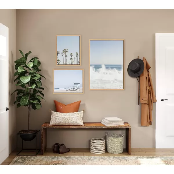 Kate and Laurel Sylvie Waves Crashing Palm Tree Paradise and Pale Blue Lifeguard Tower Framed Canvas Wall Art Set by Caroline Mint 3 Piece Set Natural Coastal Beach Art Set for Wall