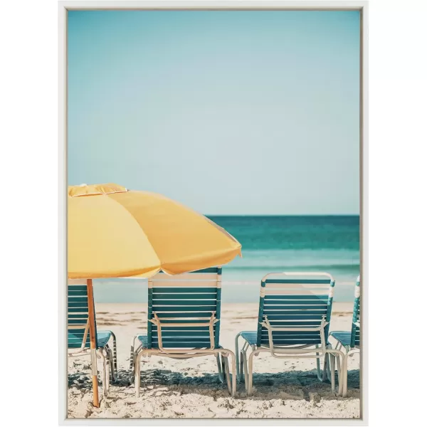 Kate and Laurel Sylvie Yellow Umbrella 2 Framed Canvas Wall Art by Alicia Bock 28x38 White Coastal Beach Chairs Photography Art for WallWhite
