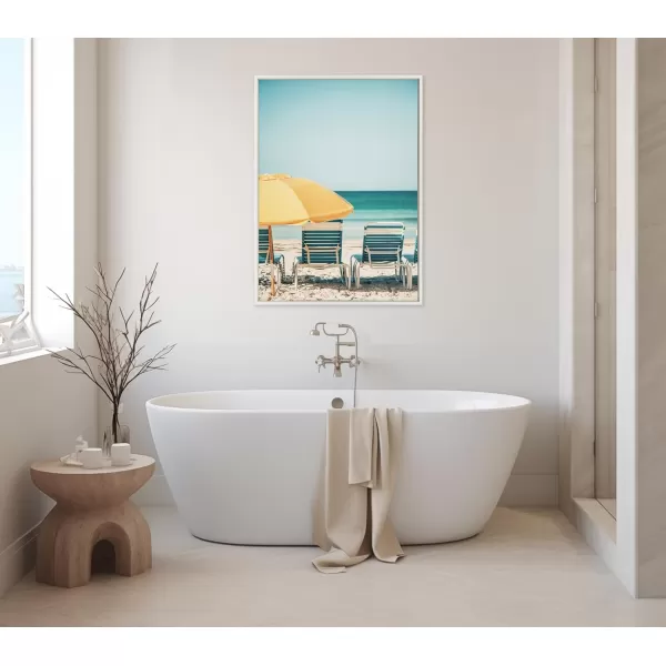 Kate and Laurel Sylvie Yellow Umbrella 2 Framed Canvas Wall Art by Alicia Bock 28x38 White Coastal Beach Chairs Photography Art for WallWhite