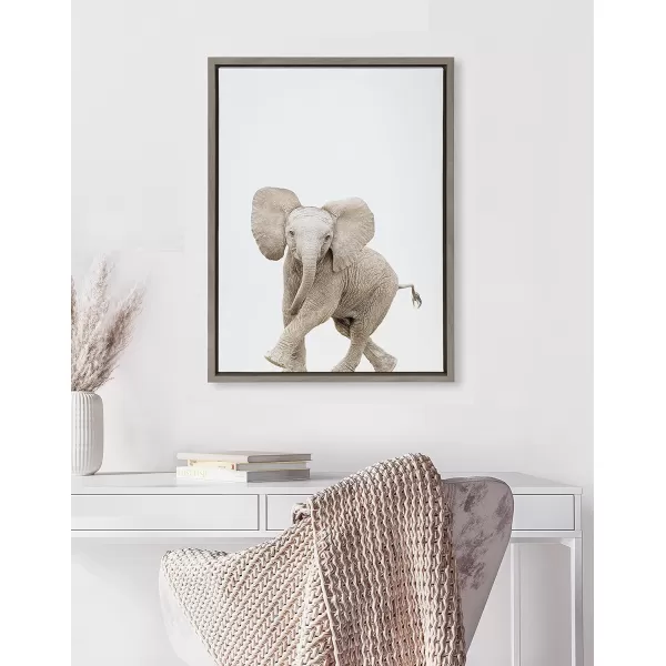 Kate and Laurel Sylvie Baby Elephant Walk Framed Canvas Wall Art by Amy Peterson Art Studio 18x24 Natural Modern Animal Portrait Art for WallGray