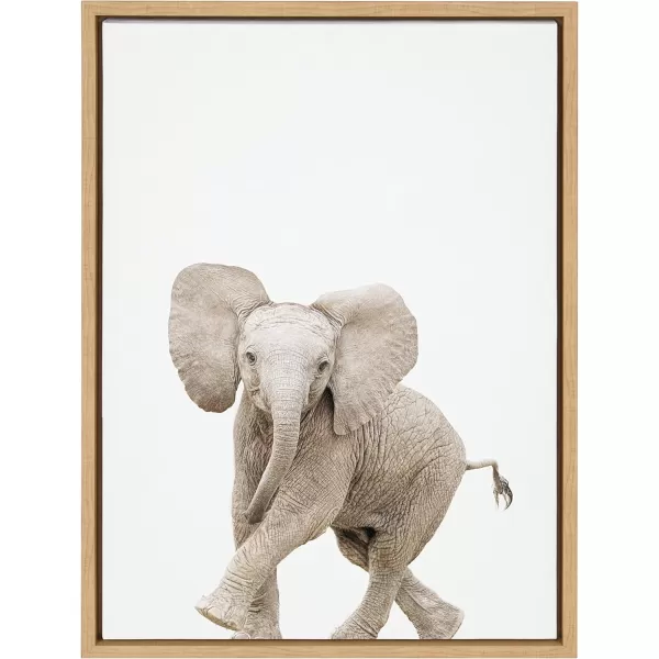 Kate and Laurel Sylvie Baby Elephant Walk Framed Canvas Wall Art by Amy Peterson Art Studio 18x24 Natural Modern Animal Portrait Art for WallNatural