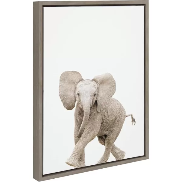 Kate and Laurel Sylvie Baby Elephant Walk Framed Canvas Wall Art by Amy Peterson Art Studio 18x24 Natural Modern Animal Portrait Art for WallGray