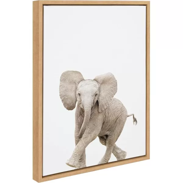 Kate and Laurel Sylvie Baby Elephant Walk Framed Canvas Wall Art by Amy Peterson Art Studio 18x24 Natural Modern Animal Portrait Art for WallNatural