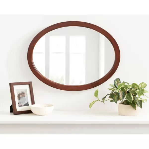 Kate and Laurel Hogan Farmhouse Oval Framed Wall Mirror 18 x 24 Natural Rustic Decorative Traditional Wood Mirror with Soft Curvature and Oval ShapeWalnut Brown