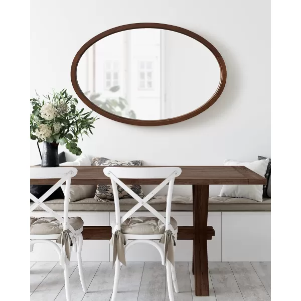 Kate and Laurel Hogan Farmhouse Oval Framed Wall Mirror 18 x 24 Natural Rustic Decorative Traditional Wood Mirror with Soft Curvature and Oval ShapeWalnut Brown