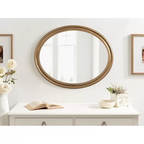 imageKate and Laurel Mansell Oval Wall Mirror 24 x 30 Rustic Brown Rustic Farmhouse Wooden Mirror with Modern Oval ShapeGold