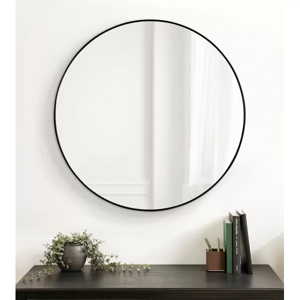 imageKate and Laurel Zayda Round Framed Wall Mirror 34 Inch Diameter Black Metal Minimalist Circular Mirror with Smooth CurvesBlack