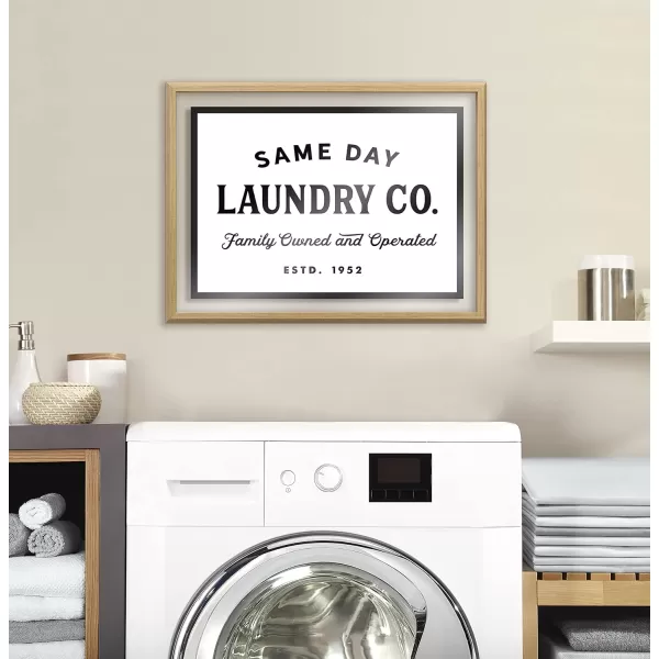 imageKate and Laurel Blake Same Day Laundry Framed Printed Glass Wall Art by Maggie Price of Hunt and Gather Goods 18 x 24 Natural Decorative Retro Art for Wall