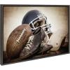 imageKate and Laurel Sylvie Vintage Football Vintage Football Gear and Vintage Football Helmet Framed Canvas Wall Art Set by Saint and Sailor Studios 3 Piece Set Gray Retro Football Art for Wall
