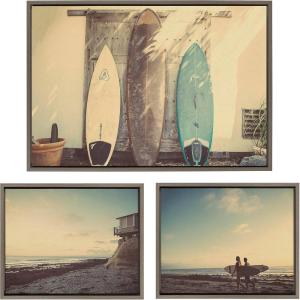 imageKate and Laurel Sylvie House on Beach Surfboards and Surfers Framed Canvas Wall Art Set by Saint and Sailor Studios 3 Piece Set Gray Coastal Beach Art for Wall
