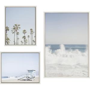 imageKate and Laurel Sylvie Waves Crashing Palm Tree Paradise and Pale Blue Lifeguard Tower Framed Canvas Wall Art Set by Caroline Mint Set of 3 two 16x20 and one 23x33 White Coastal Calming Wall Decor For Your Living Room or Bedroom