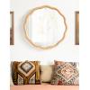 imageKate and Laurel Rahfy Boho Scalloped Round Rattan Mirror 32 Inch Diameter Natural Wood Decorative Round Wavy Mirror with Authentic Rattan Frame for Boho Wall DecorNatural