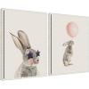 imageKate and Laurel The Bunny Star Glasses and The Bunny Pink Balloon Set of 2 18x24 Framed Canvas Wall Art Set by Iulia Emelianteva Julyartprints Sylvie Beaded White Whimsical Animals Kids