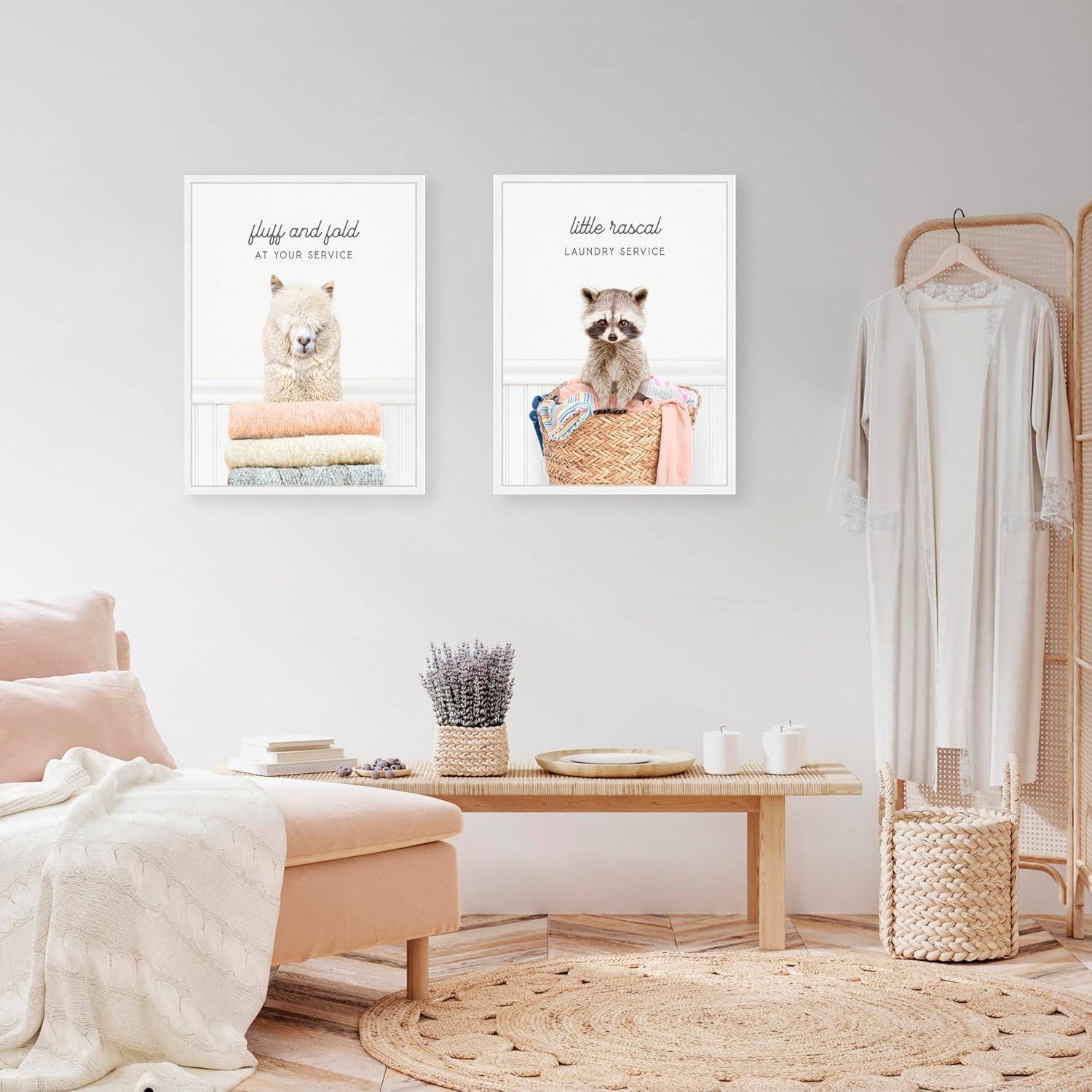 imageKate and Laurel Alpaca Fluff Fold and Racoon Little Rascal Laundry Set of 2 18x24 Framed Canvas Wall Art Set by Amy Peterson Sylvie White Whimsical Animals Humor Animals Laundry Art for Wall