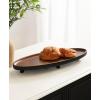 imageKate and Laurel Tomaz Modern Decorative Mango Wood Oval Footed Tray 23 x 7 Light Natural Transitional FoodSafe Wooden Coffee Table Tray with Elevated Design and Unique Oval ShapeBlackWalnut Brown