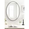 image:imageKate and Laurel Zayda Oval Framed Wall Mirror 24 x 36 Silver Metal Minimalist Oval Mirror with Smooth CurvesBlack